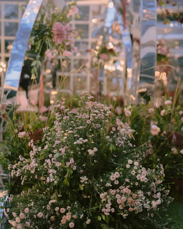 A close-up of the dreamy fresh florals surrounding the contemporary mirrored mandap we designed. Every flower is intentionally placed to create a soft, romantic, and immersive garden feel.