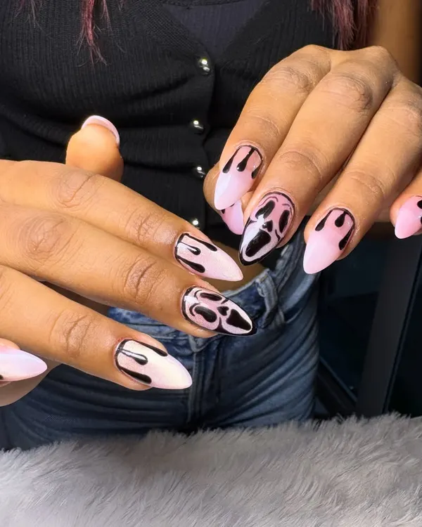Spooky season calls for spooky nails. This Halloween set features the iconic Ghostface mask and dripping blood details on a pale pink base for a look that's both creepy and chic.