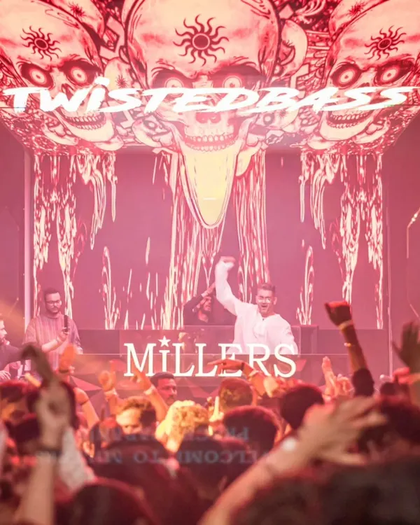 A shot from my perspective at Millers, Pune, with my 'TwistedBass' branding lighting up the incredible LED visuals behind me. The production was just as wild as the crowd.