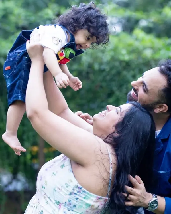 The pure joy of being lifted in the air. I love capturing these vibrant, playful moments during outdoor family photoshoots.