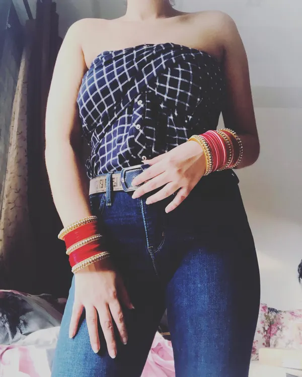 Don't give up on that old shirt just yet. Here, I've taken a standard button-down and creatively styled it into a strapless tube top, giving it a whole new life. This is a core part of my wardrobe remixing sessions.