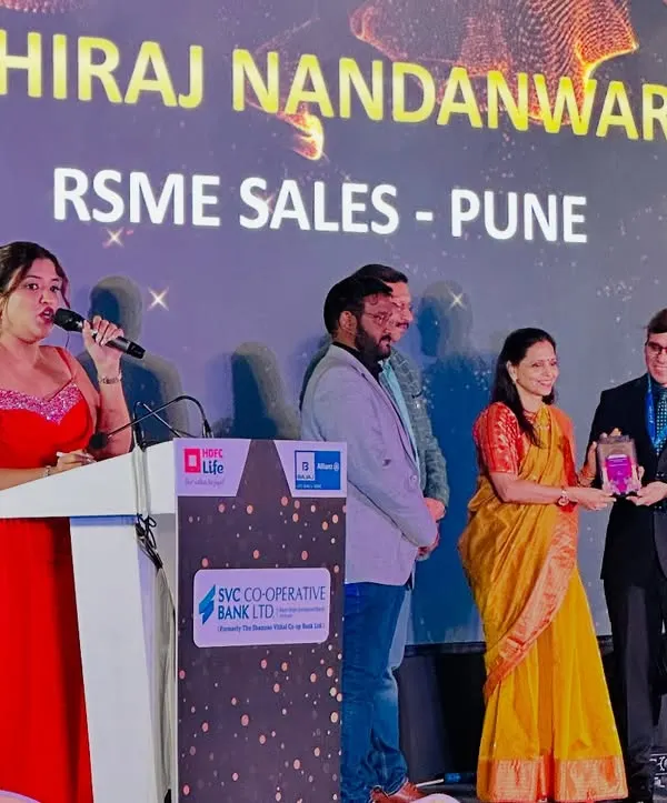 On stage at the HDFC Life & SVC Bank awards ceremony in Jaipur. It is an honor to announce the winners and celebrate their achievements in the finance sector.