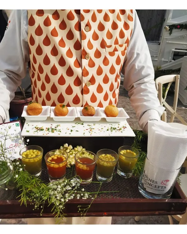 A modern take on a classic street food. Our deconstructed Pani Puri is served on an elegant tray, with flavour-infused waters in individual shot glasses for a sophisticated presentation.