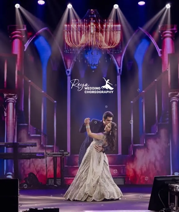 A classic ballroom moment against a grand, palatial backdrop. This choreography focused on elegance and romance, making the couple look and feel like royalty on their special night.