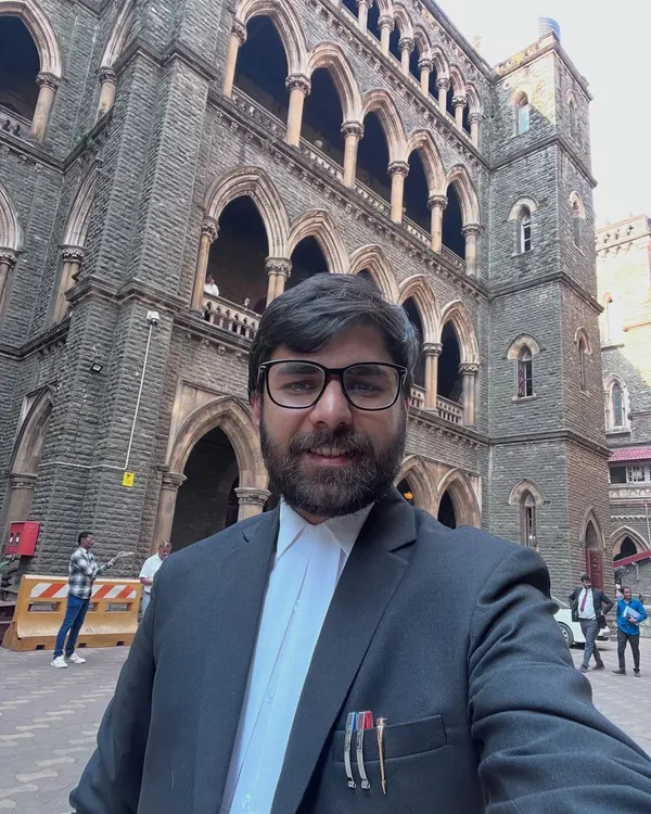 A moment outside the historic Bombay High Court. Being a criminal lawyer means I am constantly moving between different courts, always ready to represent my clients wherever justice is sought.
