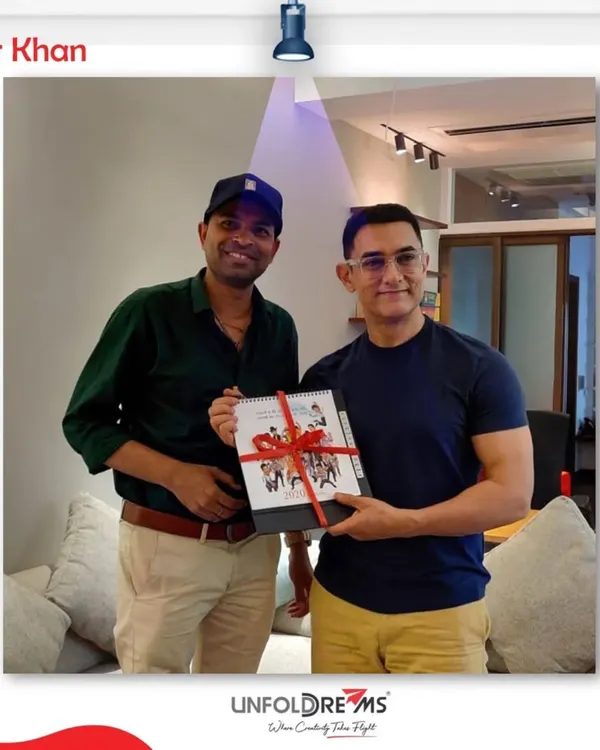 Presenting a special calendar featuring my caricatures to Aamir Khan. He has always been a great supporter of my work, using it for various occasions.