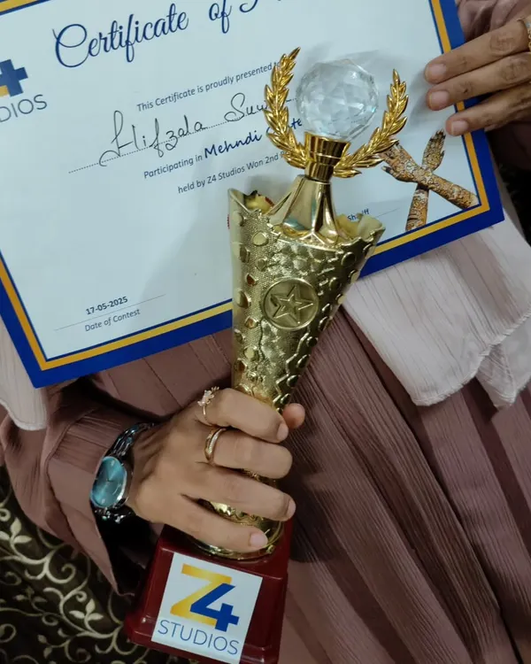 So proud to have received this trophy and certificate. It's an honor to be recognized for my passion and hard work in the art of mehendi.
