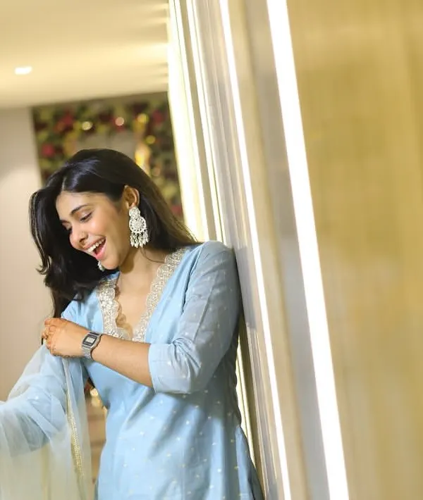 A candid shot of a guest laughing during a party. I use the architectural elements and lighting of the venue to frame my subjects and create natural, interesting portraits.