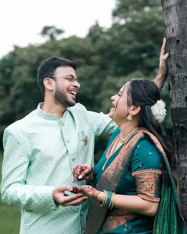 This is the essence of our photography. A moment of pure, uninhibited laughter between a couple, captured naturally during their outdoor pre-wedding shoot.