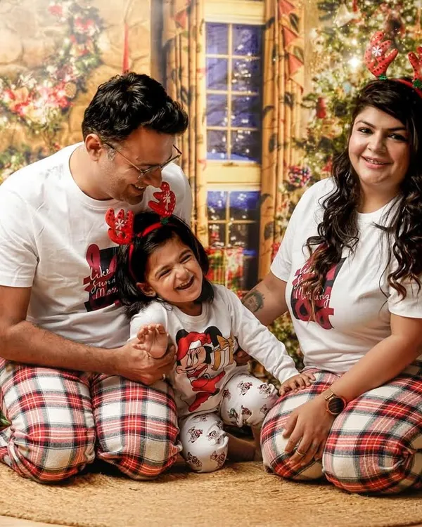 The best gift is family. This joyful family portrait, with everyone in matching Christmas pajamas, perfectly captures the warmth and happiness of the holiday season in our festive studio.