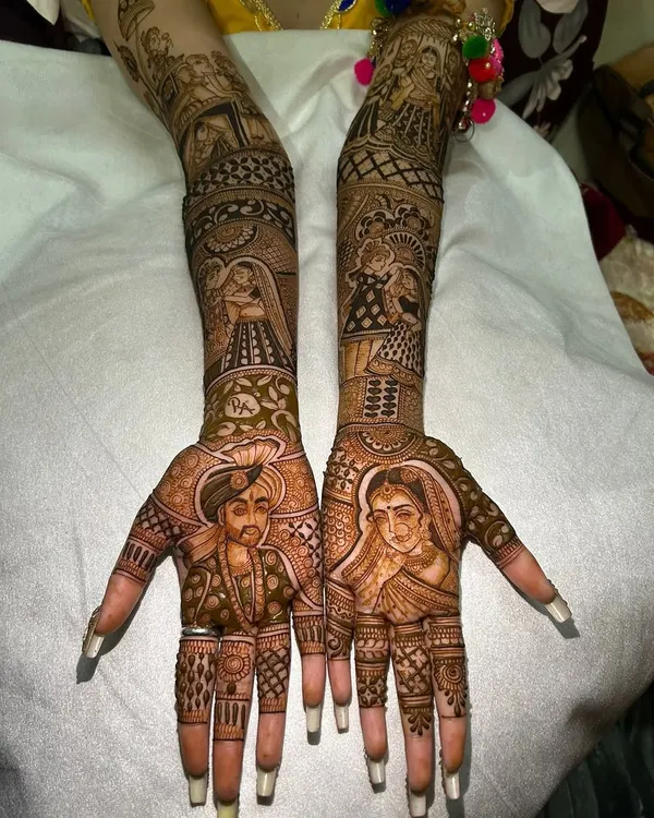 A masterpiece of personalization, this design features lifelike portraits of the bride and groom, capturing their likeness in henna. This is my specialty and the ultimate way to make your bridal mehandi unique.