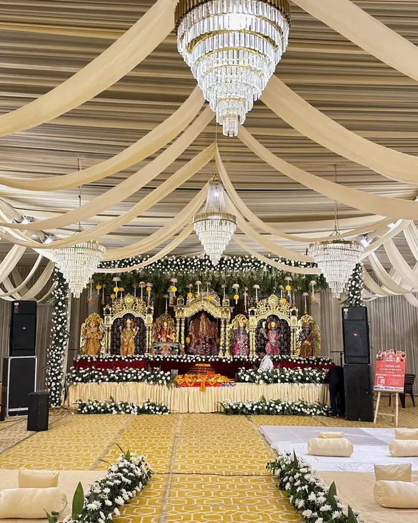 This is the kind of grandeur we love to create for sacred events like a Maa Bhagwati Jagran. We designed the entire space, from the magnificent stage for the deities, adorned with fresh flowers and elegant draping, to the comfortable floor seating for devotees, ensuring a divine and immersive experience.