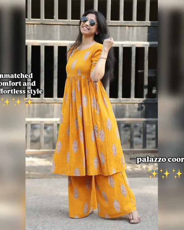 Unmatched comfort and effortless style. This image highlights the flowy silhouette of our yellow printed palazzo co-ords, perfect for a sunny day.