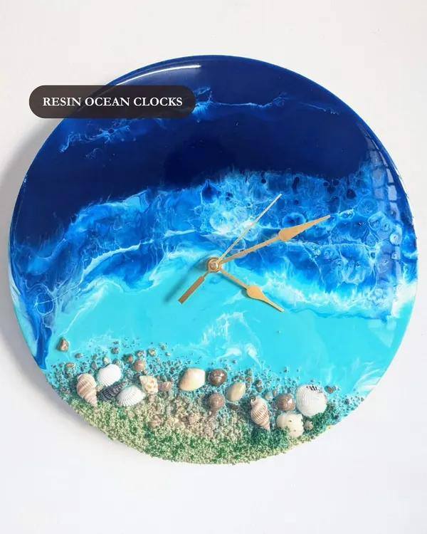 This resin ocean clock is one of my most popular items. It combines the beauty of art with the function of a timepiece, featuring real shells and sand.