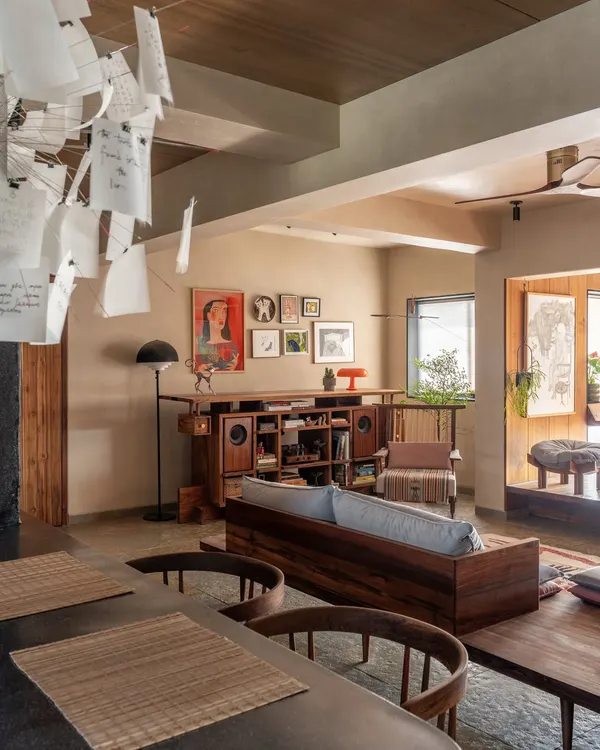 This living room from our 'Home of Stories' project in Mumbai captures our love for warm minimalism. We designed the space around the clients' collection of art and artifacts, using natural wood and a neutral lime-wash palette to let their personal stories take center stage.