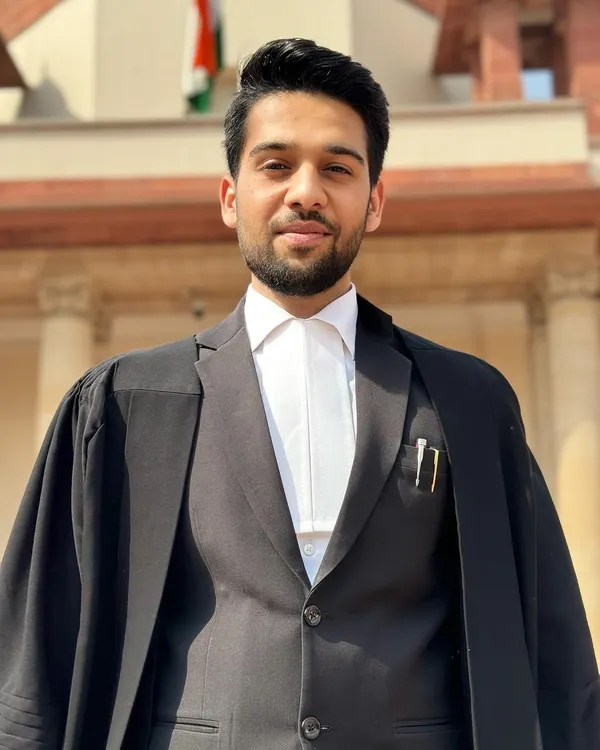 Dressed in my advocate's robes outside the Supreme Court of India. My practice is rooted in years of navigating the highest levels of the Indian judicial system.
