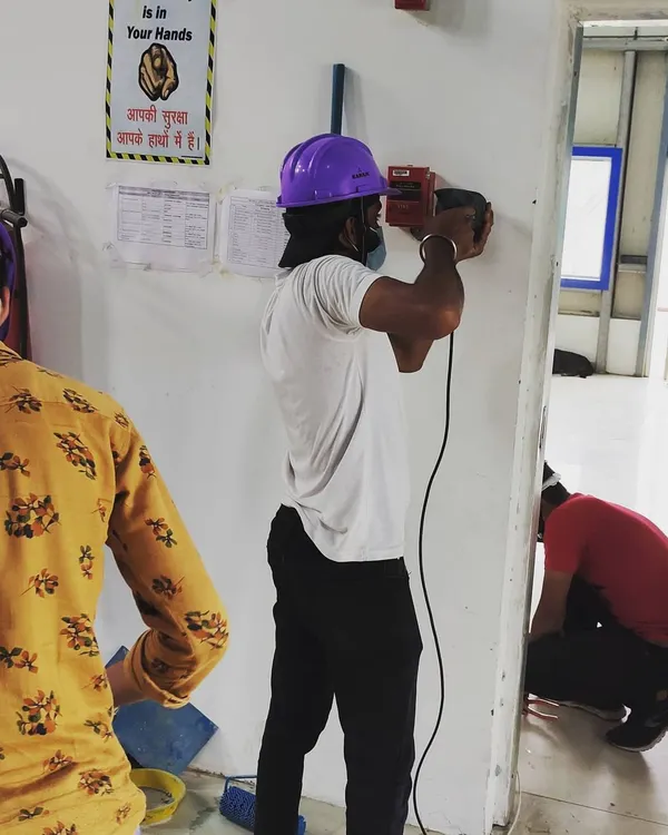 Here is a look at our technician beginning the physical installation of an access control system. We use professional-grade tools to ensure every device, from fingerprint scanners to door locks, is mounted securely and correctly for long-term, reliable operation.