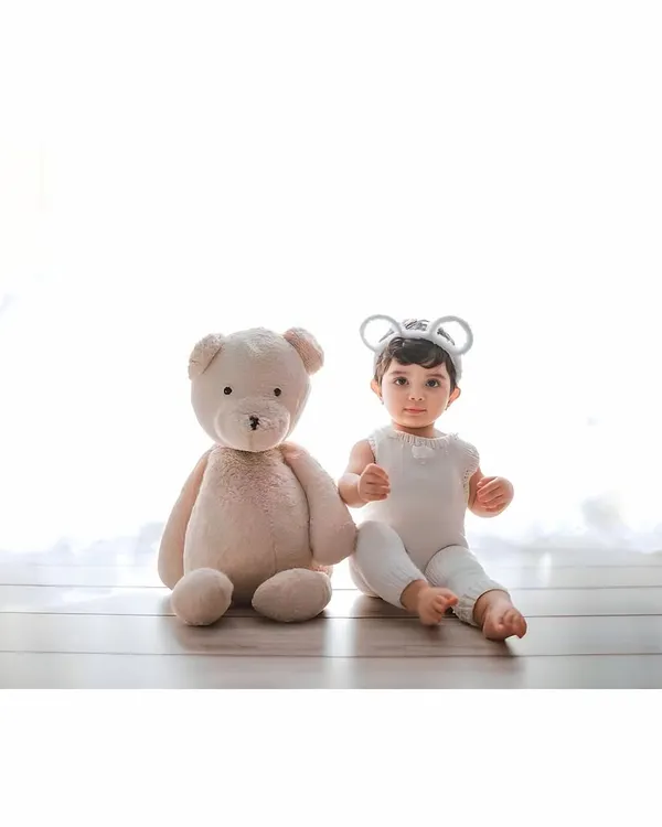 A sweet little mouse and his best friend, the teddy bear. My studio sessions with high-key white backgrounds are perfect for creating these bright and adorable portraits.