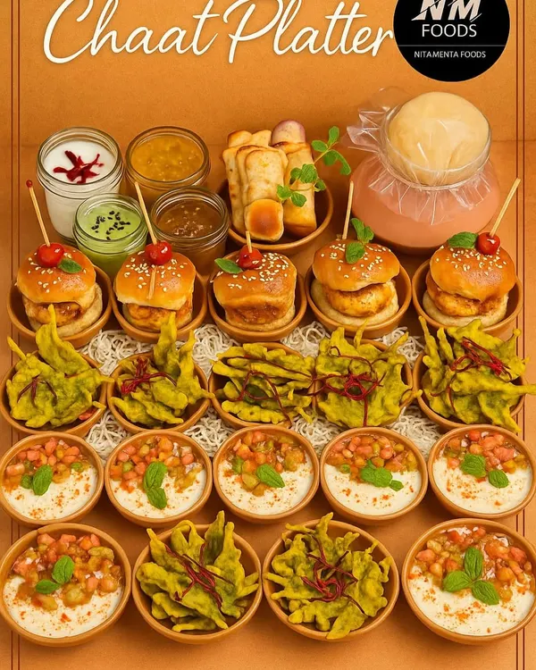 This chaat platter is a feast for the senses, showcasing the sheer variety we can offer. It features miniature Vada Pavs, Palak Patta Chaat, and Kachoris, providing a comprehensive taste of Mumbai's best street food in one beautifully arranged spread.