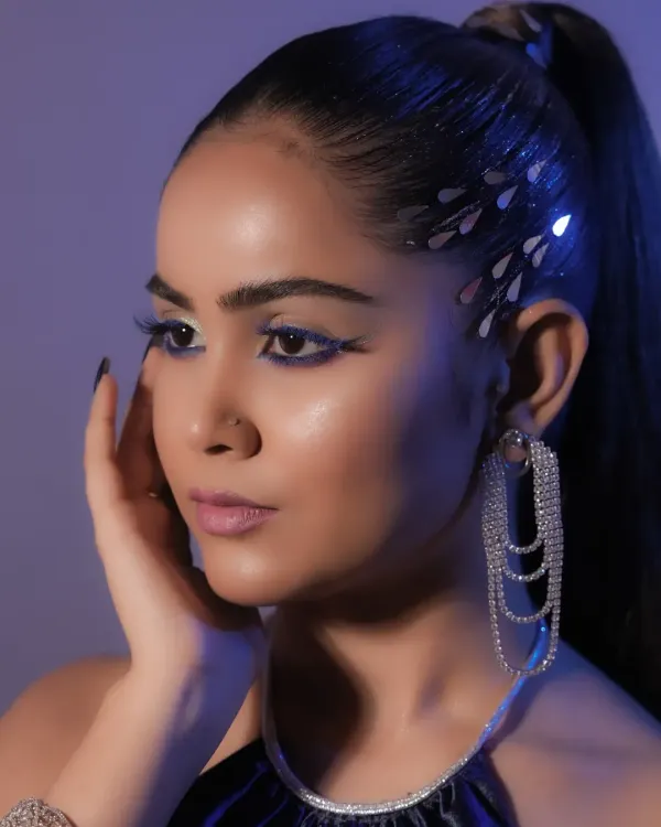 A different angle of our high-fashion look, showcasing the sleek ponytail and the way the light catches the metallic hair details.