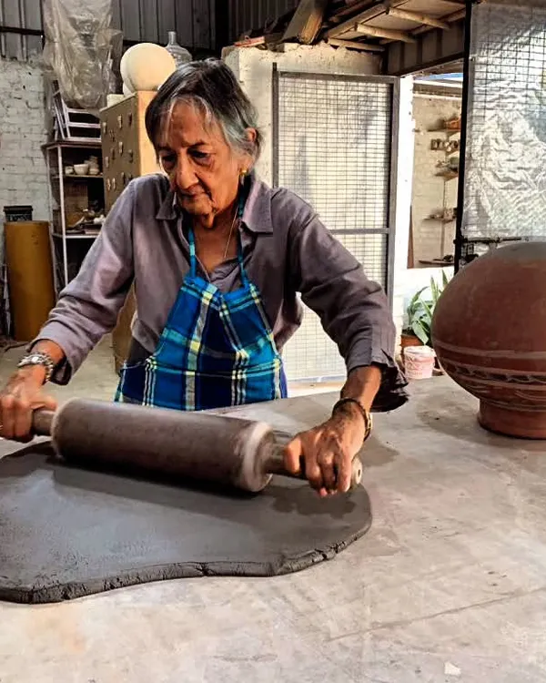 There is so much strength and grace in these hands. Here, a student is rolling out a large slab of clay, the first step to creating a big, impressive hand-built piece.