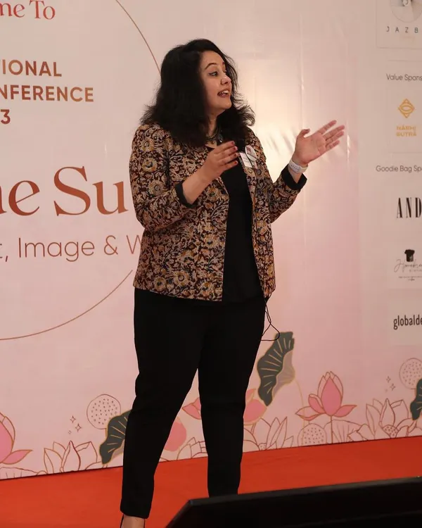 As a keynote speaker, my goal is to connect with the audience and deliver insights on personal branding and leadership that they can apply immediately. Here I am on stage, discussing how to build a powerful professional image.