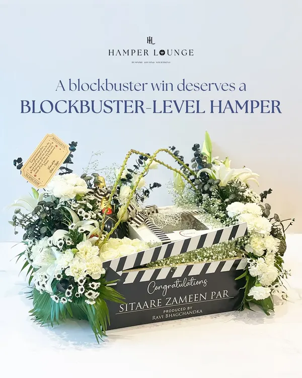 This is the hero shot of the 'Sitaare Zameen Par' hamper I created for the film's cast and crew. The custom clapperboard box, filled with champagne and flowers, is a prime example of how I tailor gifts to a specific event, making the celebration even more memorable.