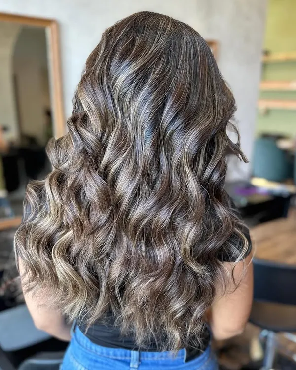 This frosty, multi-tonal look was the result of an eight-hour color correction session. It showcases the advanced skills and patience required to tackle complex hair challenges.