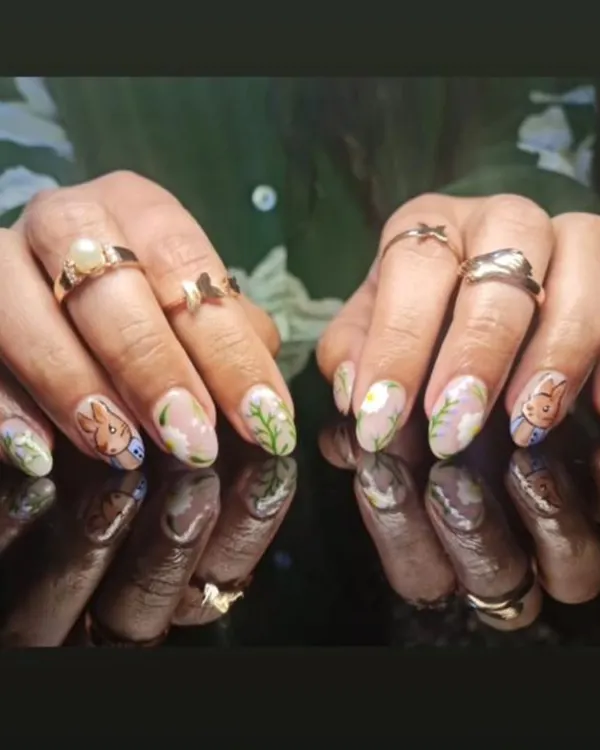 A whimsical and charming design featuring hand-painted bunnies and delicate foliage on a sheer, natural-looking base.