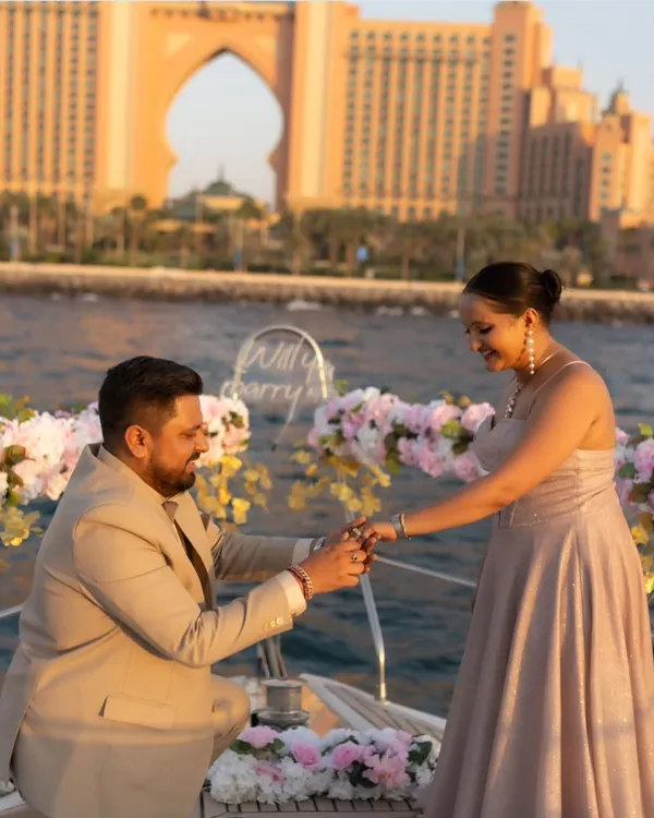 The perfect proposal moment captured on a yacht in Dubai, with the iconic Atlantis hotel in the background. A truly unforgettable memory from a luxury pre-wedding shoot.