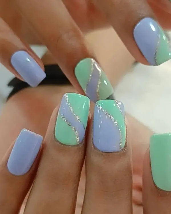 A lovely pastel combination of mint green and lavender, accented with a wavy silver glitter line for a soft and pretty look.