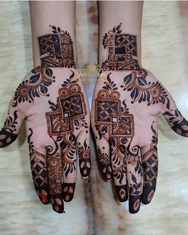 A modern and stylish design perfect for bridesmaids or wedding guests. This pattern uses geometric blocks and delicate leafy vines for a contemporary twist on traditional henna.