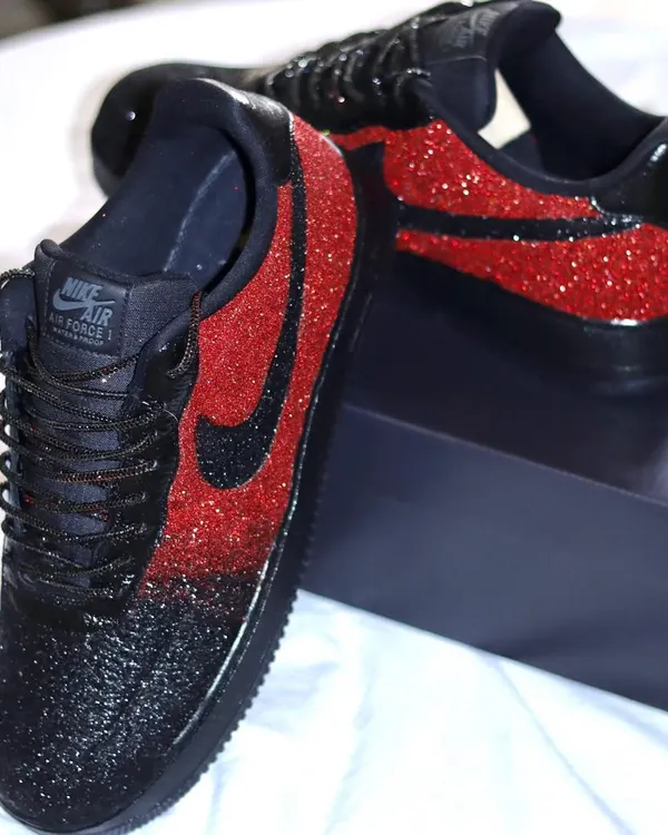 For when you want to be extra. These custom Nike Air Force 1s feature a black and red ombre glitter design that is guaranteed to turn heads. I even added rhinestone shoelaces for maximum sparkle.