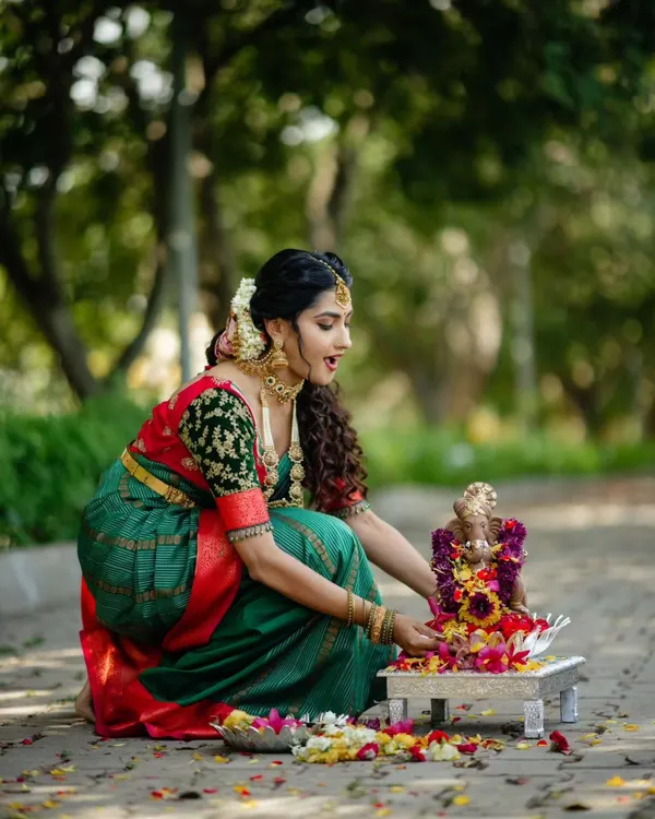 Celebrating Gowri Ganesha Habba in style. This traditional green and red silk saree is perfect for festive occasions.