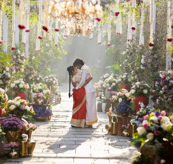 A fairytale moment for the couple, surrounded by a breathtaking floral walkway. I believe in creating grand, cinematic frames that feel as magical as the day itself.
