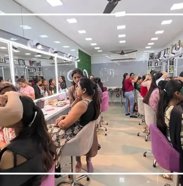 A look inside our bustling classroom. Every student gets a dedicated station with professional lighting to practice and perfect their skills. This is a hands-on learning environment.
