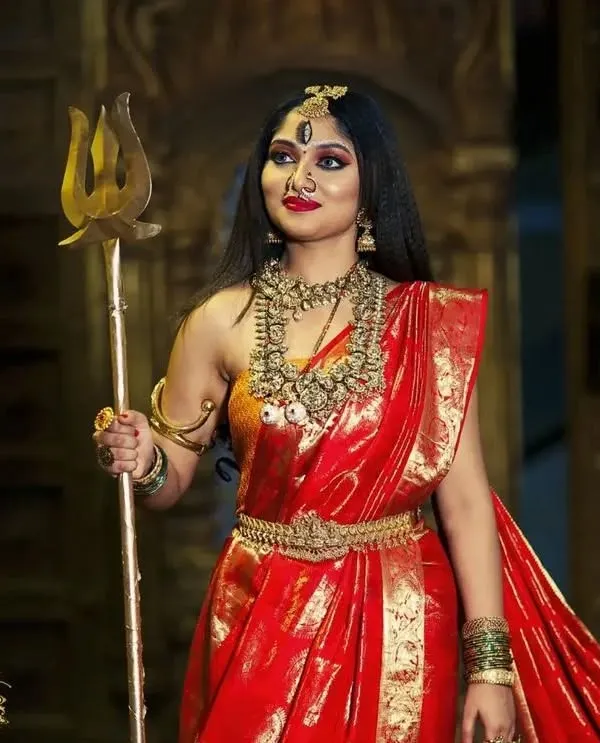A powerful depiction of Goddess Durga, adorned in our heavy temple jewellery. This look features a layered haram, choker, and traditional armlets, perfect for Navaratri.
