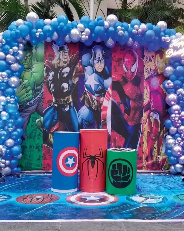 An epic superhero theme party featuring a full backdrop of Marvel's mightiest heroes. We completed the look with a blue and silver balloon arch and themed pedestals for Captain America, Spider-Man, and the Hulk.