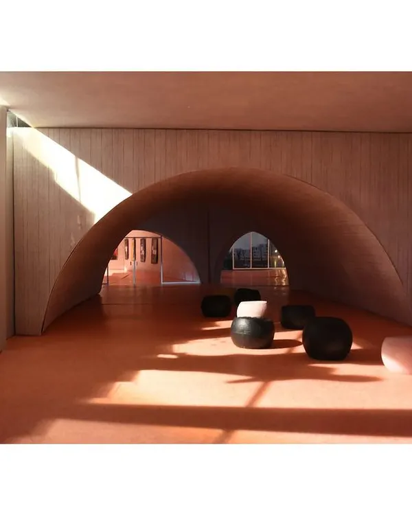Handmade models are a critical part of our design process. This scale model allowed us to test the play of light and shadow under a series of vaulted arches, helping us refine the form and spatial experience long before construction.