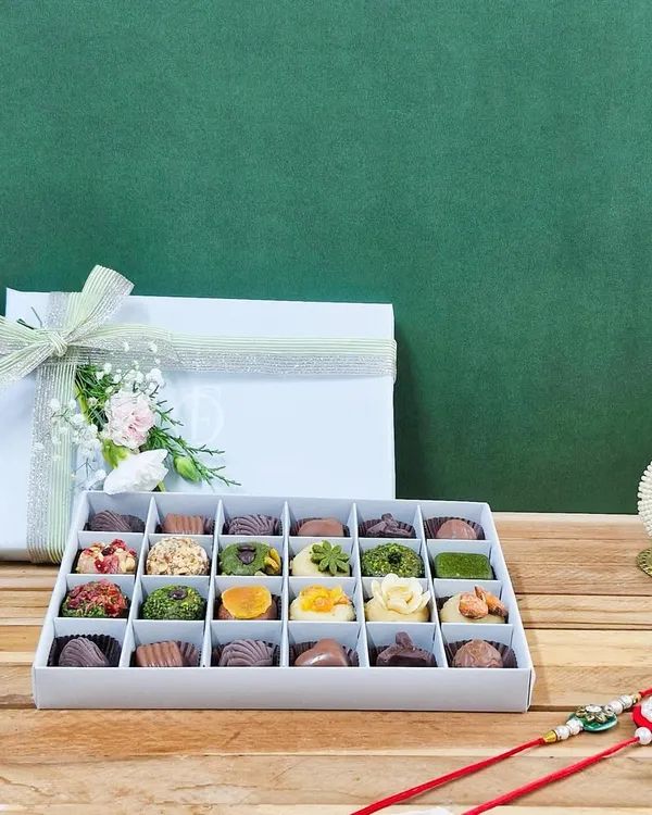 Gift your sibling the purest form of love with our 'Rakhi ki Mitaas'. This 24-piece box of exotic dry fruit mithai is crafted without ghee or artificial flavours, making it a healthy and luxurious Rakhi gift.