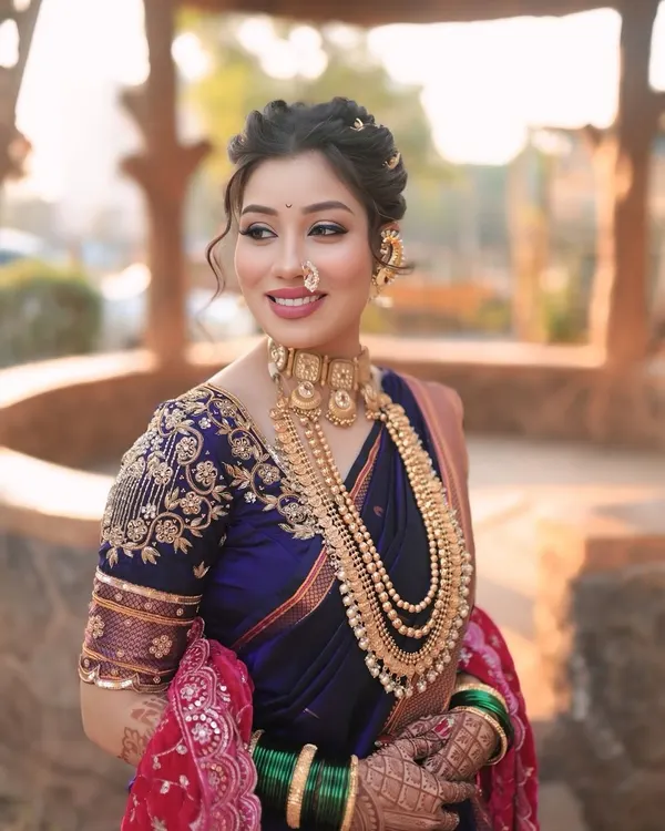 A classic Maharashtrian bridal look, showcasing soft glam makeup that enhances natural beauty. We focused on creating a radiant complexion, complemented by a traditional bindi and nath, and paired with an elegant, softly waved updo.