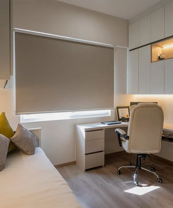 A perfect example of a multi-functional room. This space serves as a home office with a corner desk and overhead storage, and also as a guest room with a comfortable daybed.