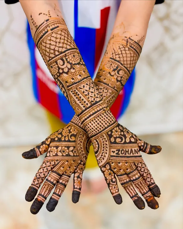 Even our youngest clients can get elaborate designs. This 6-year-old chose a full-arm mehendi, and we were happy to oblige with our skin-safe organic paste.