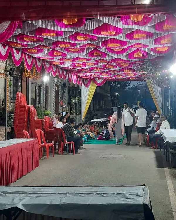 A wide view of a street event we organized at night. You can see the extensive ceiling decoration, lighting, and seating arrangements we put in place to create a festive atmosphere for the guests.