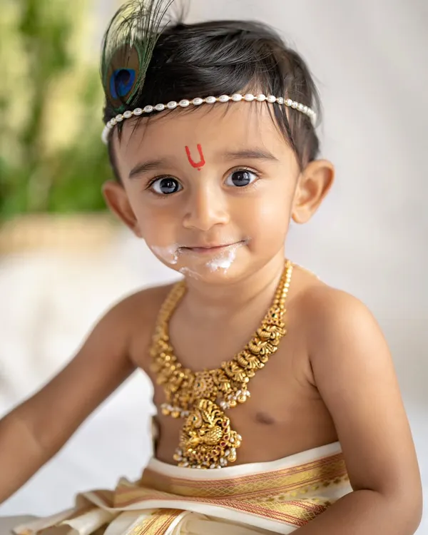 My little Krishna, with a little bit of butter on his face. These themed sessions are so much fun and create such memorable portraits.