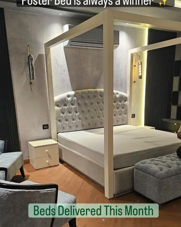 A poster bed is always a winner for adding a touch of drama. This modern four-poster bed features a classic button-tufted headboard and provides a grand focal point for the bedroom.