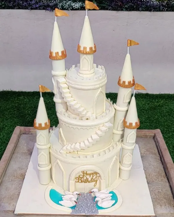 This grand, all-white castle cake is a perfect example of how I can turn a fairytale dream into an edible reality. The intricate details, from the towering turrets to the delicate swans, make it a stunning centerpiece for a truly magical birthday celebration.