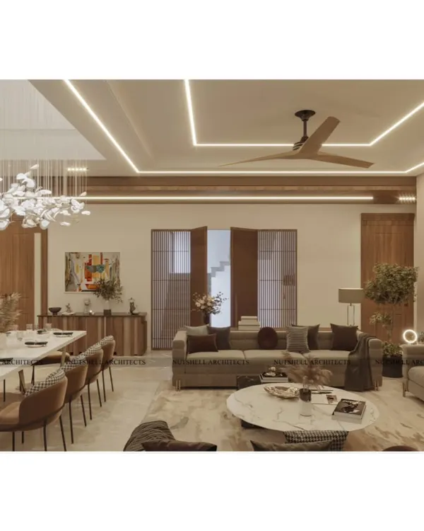 Another perspective of the double-height living space, looking towards the entrance. The design emphasizes an open, flowing layout, with the geometric patterns of the cove lighting on the ceiling mirroring the expansive feel of the room.