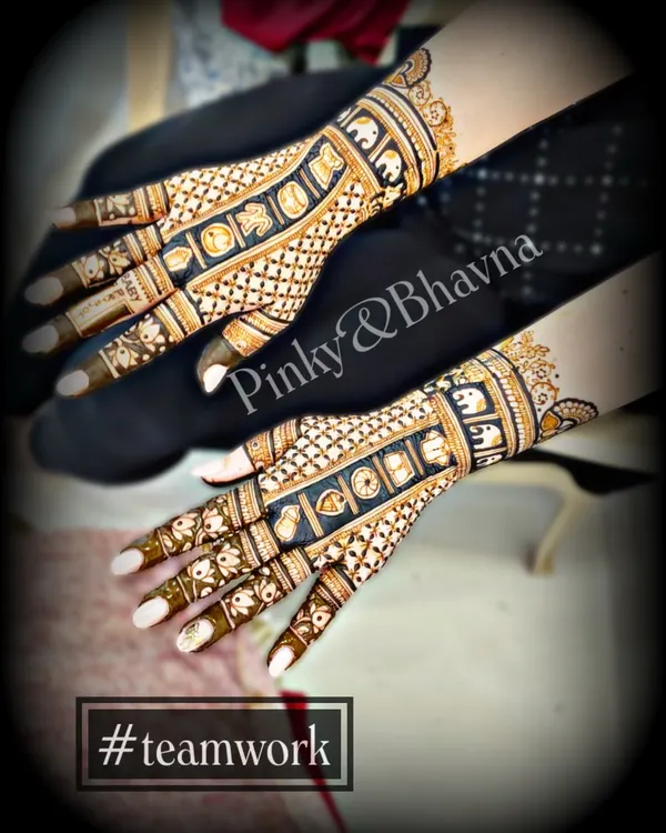 A beautiful example of teamwork. This design features bands of elephants and geometric patterns, created collaboratively by me and my partner Pinky.