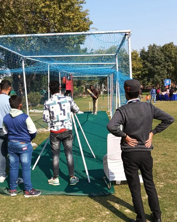 For cricket lovers, I offer a cricket bowling machine with a netted practice pitch. It's a fantastic and engaging activity for sports-themed parties and corporate family days.